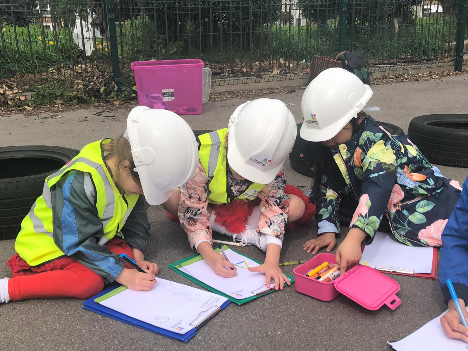 Children drawing the playground installation process