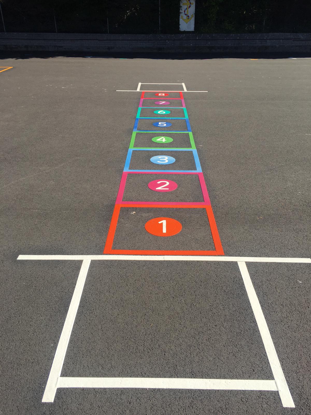 Painted Games on Playground Hopscotch