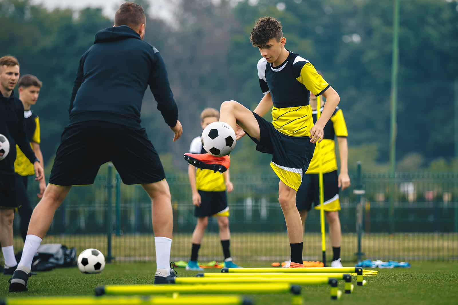 kids playing with football sports equipment