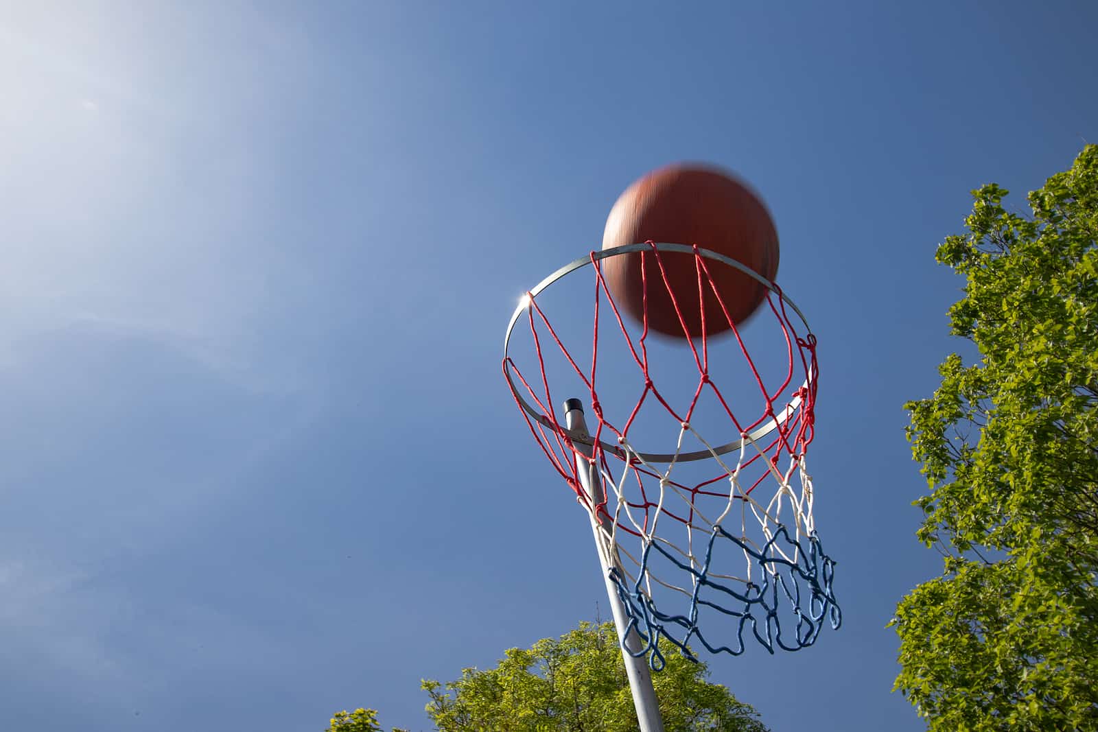 a ball entering the net during a school netball match