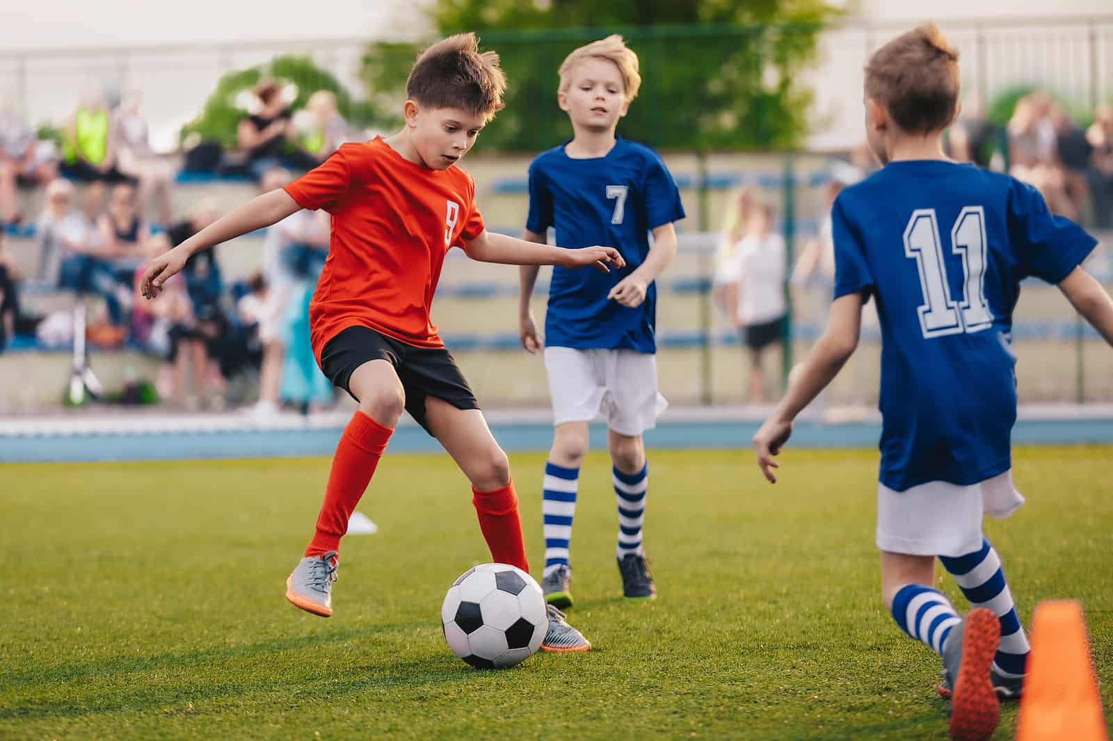 boys playing football at school